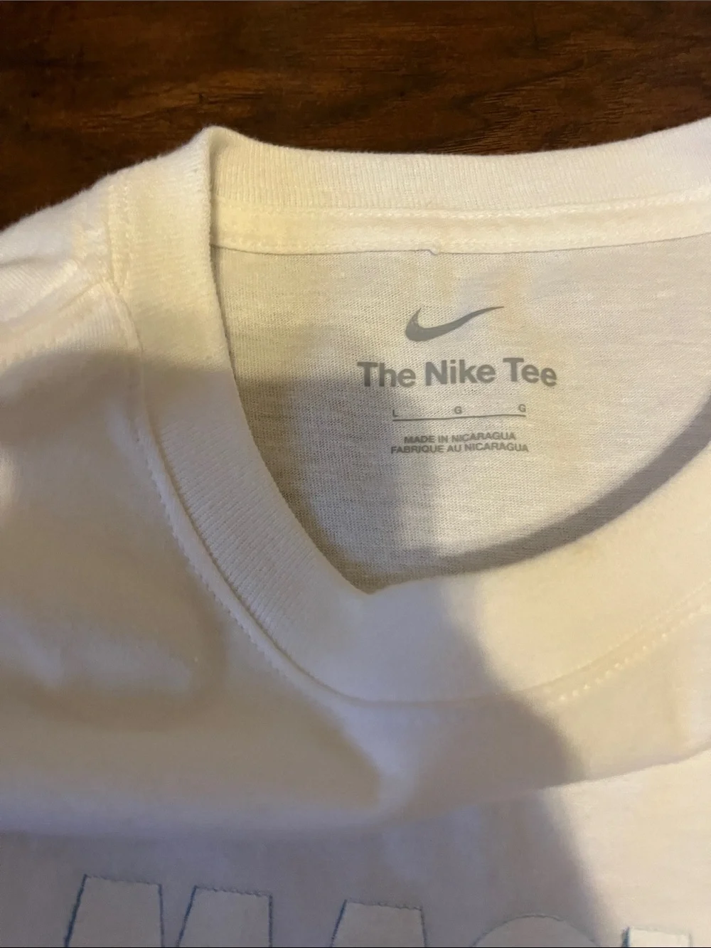 Nike White Kids Graphic Tee with Multicolor 'Magic Is In The Air' Design